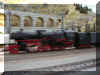 DB class 52 with condensing tender speeding through the station